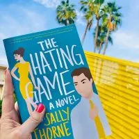 The Hating Game Book Cover in front of a palm tree
