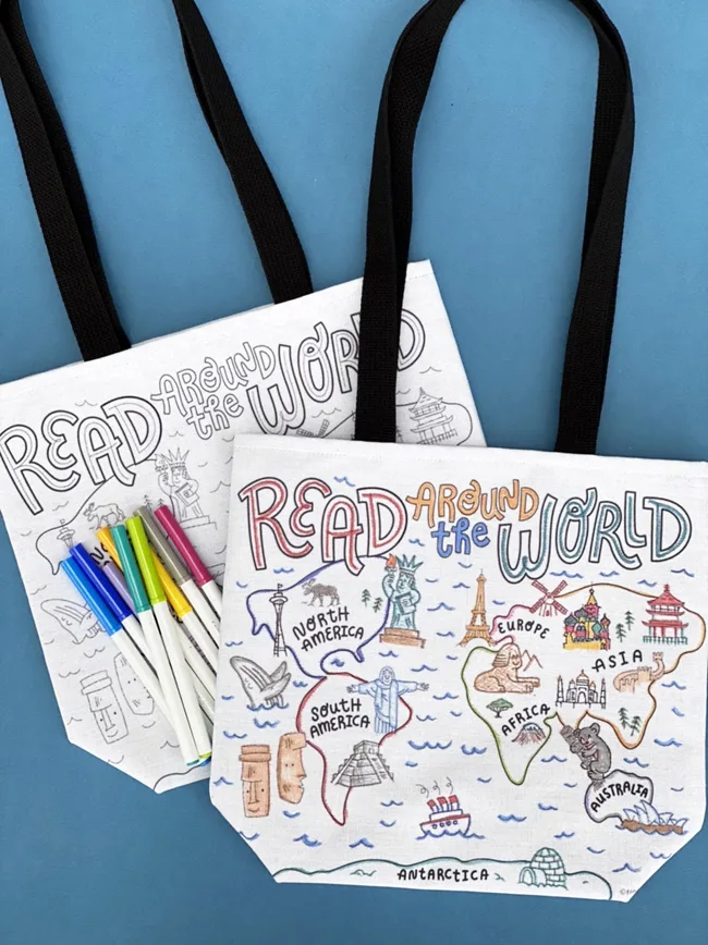 two world map library tote bags with markers for coloring