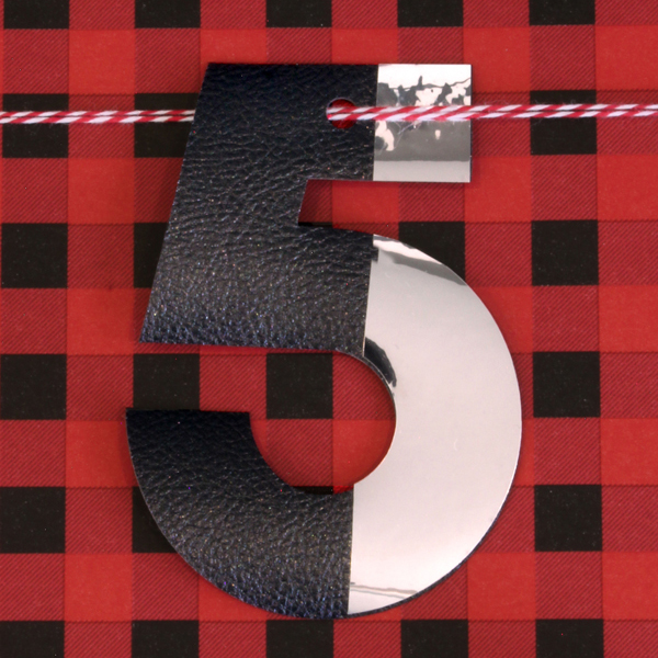 red and blacked checked wrapping paper with a number 5 gift tag