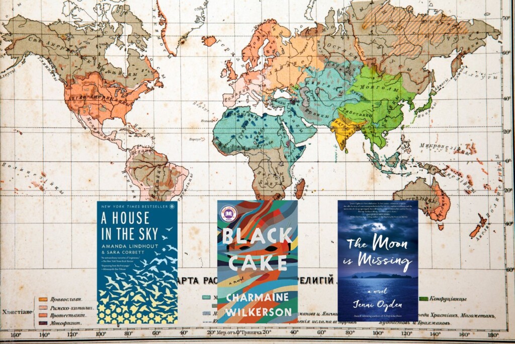 World map photo with three book covers on top