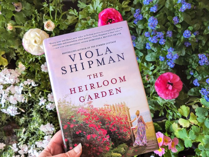 The Heirloom Garden book with woman next to a wall of flowers on the cover