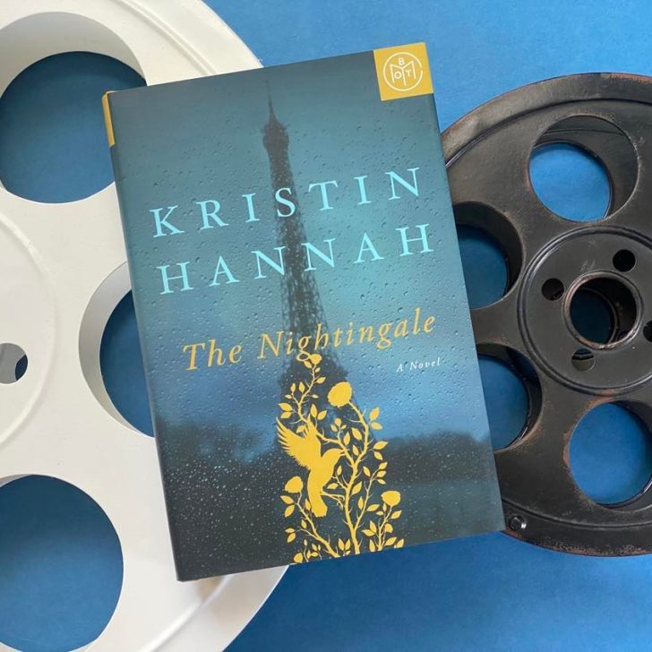 Photo of the Kristin Hannah book, The Nightingale, sitting atop two film reels.