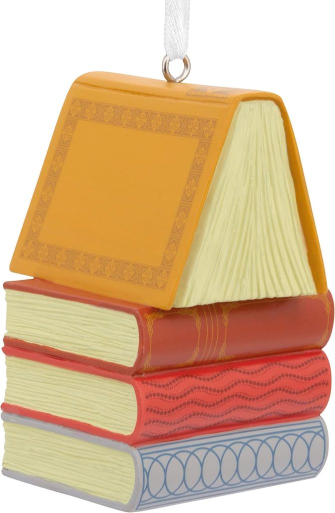 Christmas ornament with a stack of four books with blue, red and orange spines