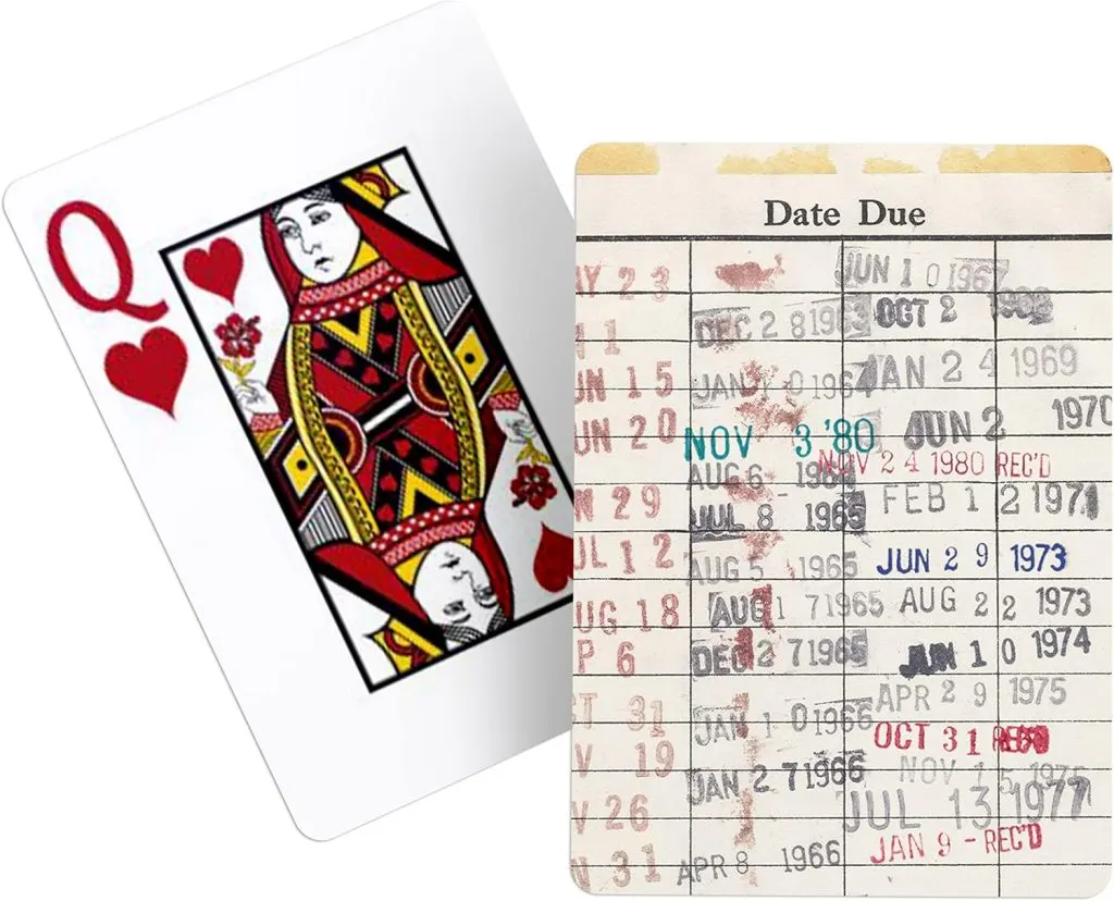 Deck of playing cards with vintage library due date stamps on the back
