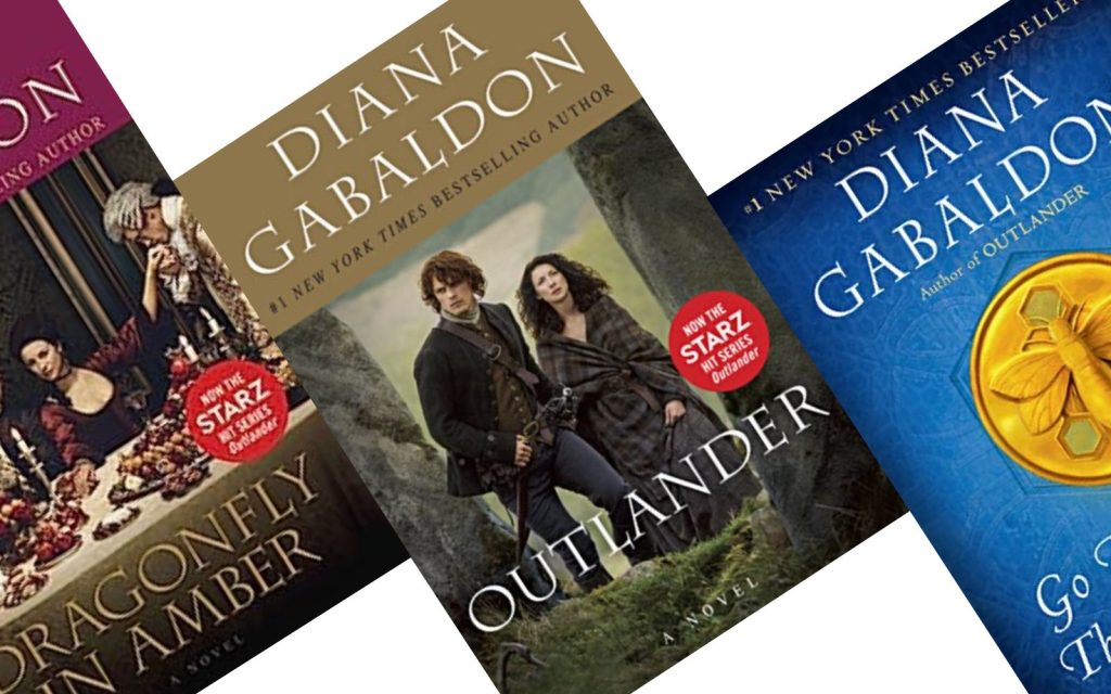 Outlander book cover tilted with two others in the series representing the Outlander books in order. 