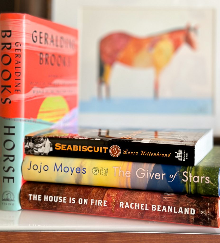 Three books horizontal, Seabiscuit, Giver of Stars, and The House is on Fire, representing books for fans of Horse