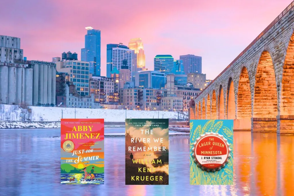Skyline of Minnesota over water with 3 books