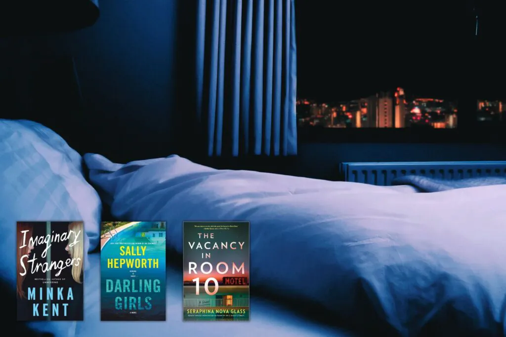 Dark bedroom with empty bed of view of dark city with three books overlaid