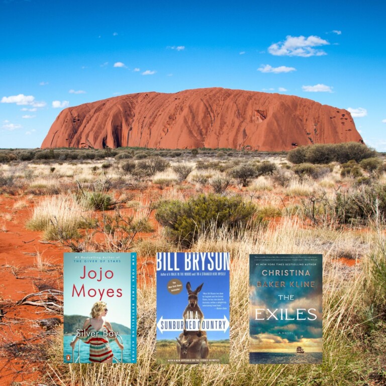 Uluru photo with three book covers on top