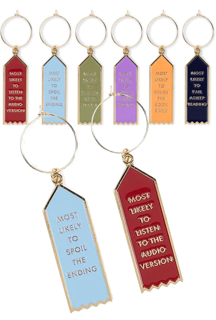 Set of 6 Kate Spade book themed wine charms with a close up on two of them