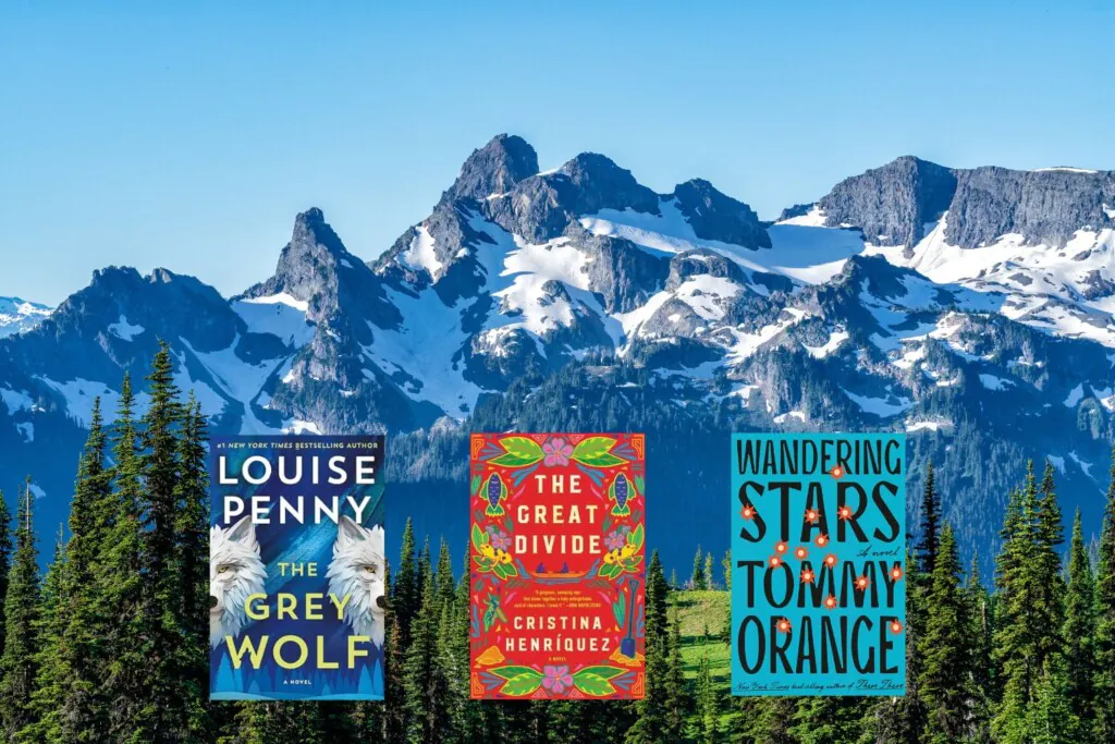 North American mountain range photo with three book covers on top