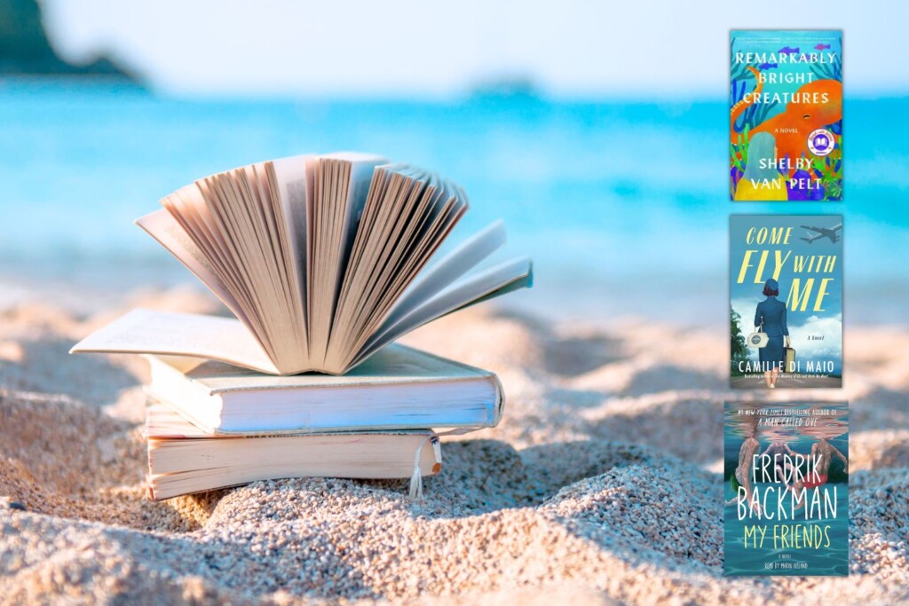 stack of books on beach with book covers from this list of summer book club books
