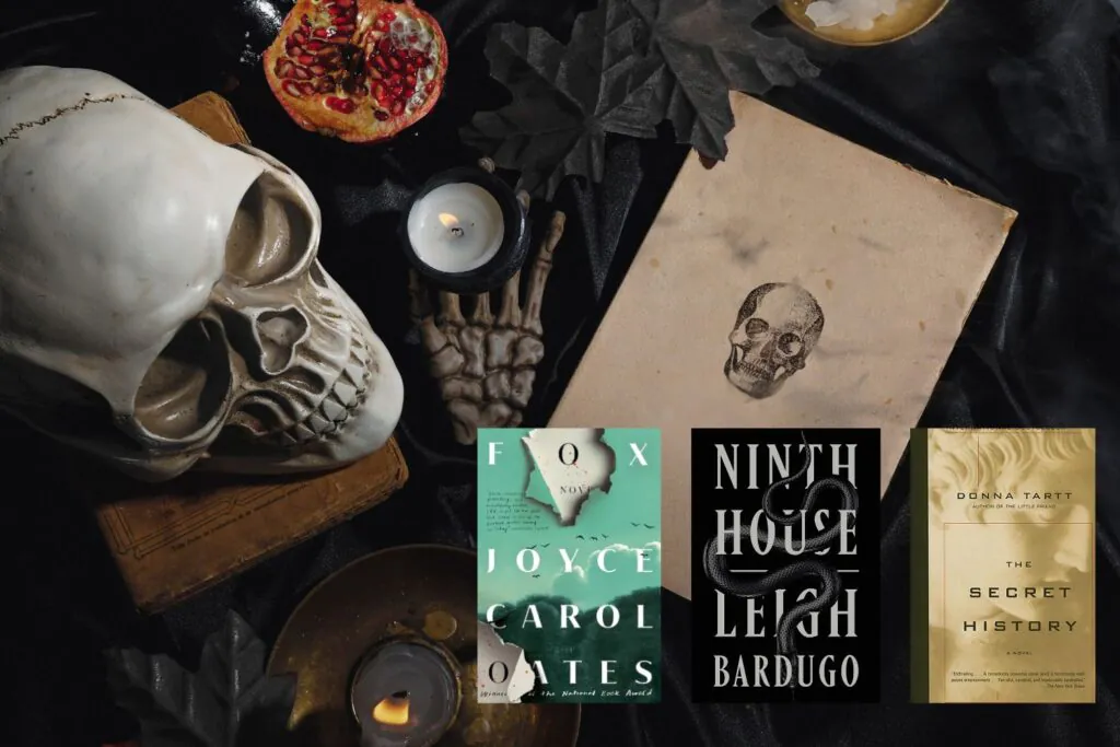 Flatlay image of old books, a skull, candles, and black leaves overlayed with three Dark Academia book covers