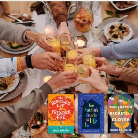 Many hands cheers-ing over a full table of food with 3 book covers