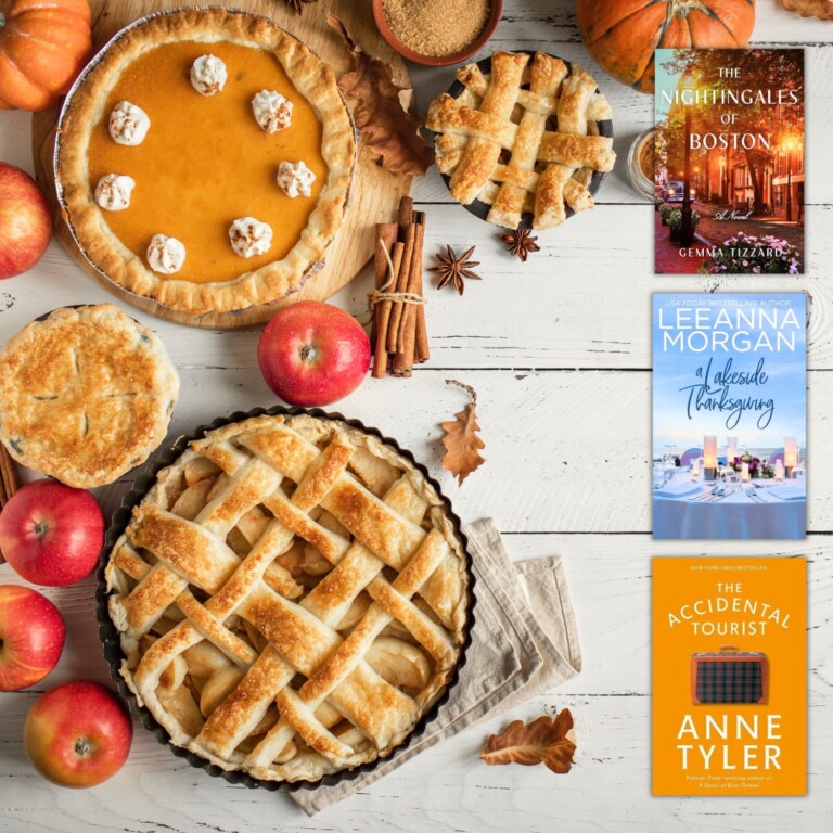 Flatlay photo of pumpkins, apples, and Thanksgiving pies on a white weathered wood background with three covers of Thanksgiving themed books for adults