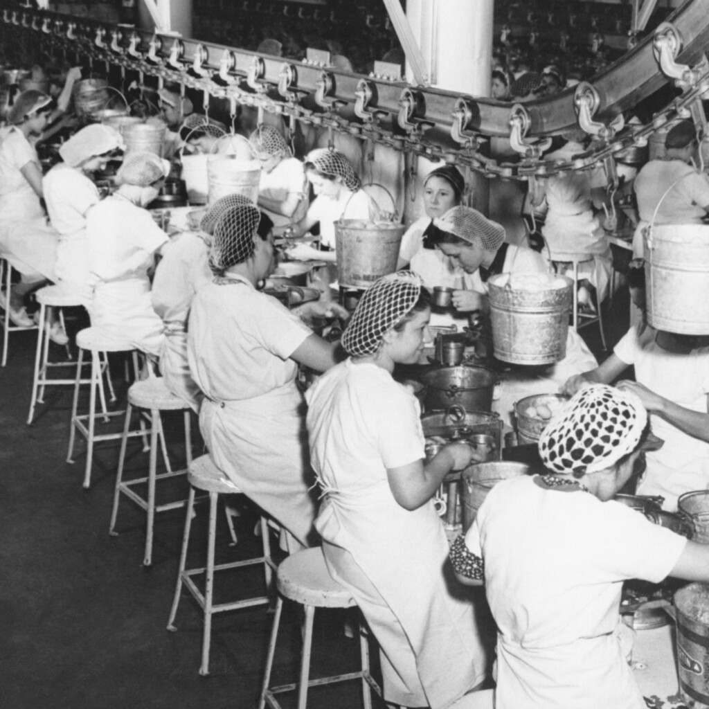 Black and White Photo of women working on an assembly line