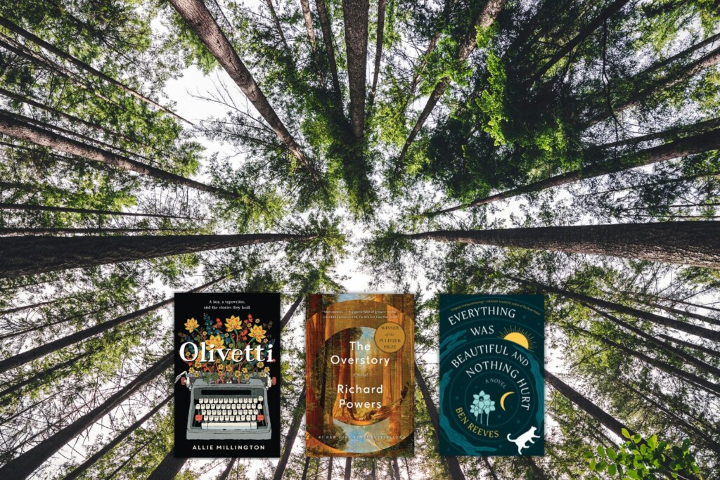 View of tall trees from below with 3 book covers