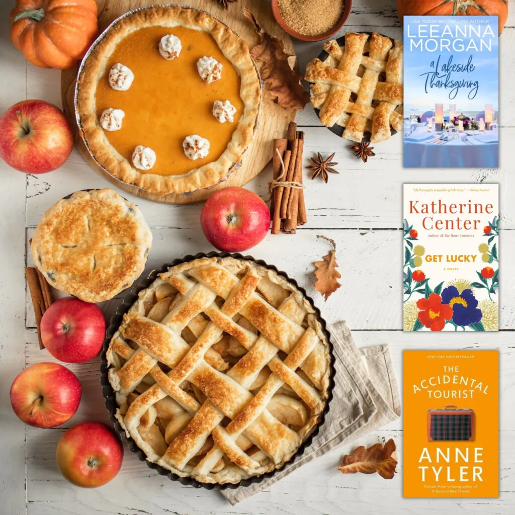 Flatlay photo of pumpkins, apples, and Thanksgiving pies on a white weathered wood background with three covers of Thanksgiving themed books for adults