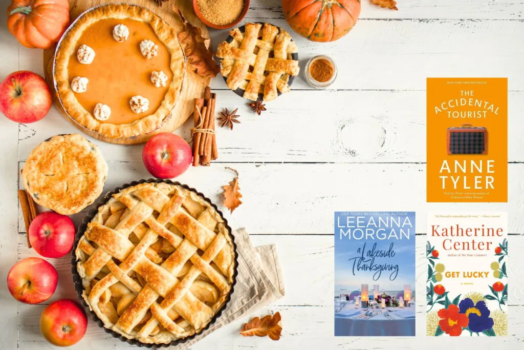 Flatlay photo of pumpkins, apples, and Thanksgiving pies on a white weathered wood background with three covers of Thanksgiving themed novels 
