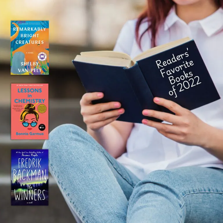 A woman in a white shirt and blue jeans sits on a stair holding a book with text on the cover that says "Readers' Favorite Books of 2022"