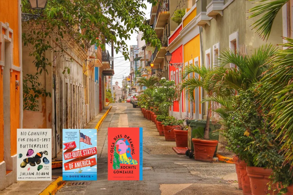 Photo of a colorful street in old San Juan, Puerto Rico with three covers of books set in the US Territories
