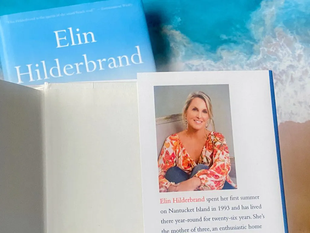 Photo of two Elin Hilderbrand novels with one open to the inside of the back cover with her photo and bio