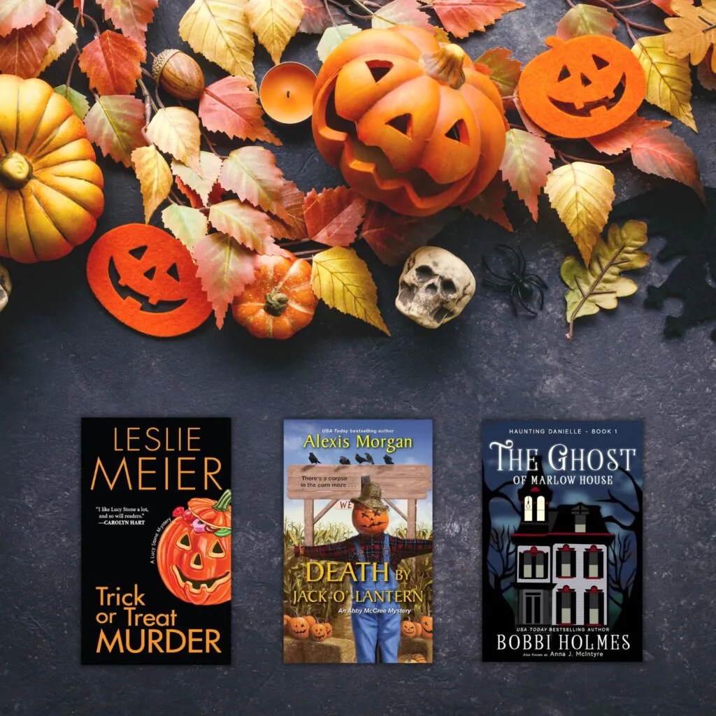 black chalkboard with orange halloween decorations and three halloween books