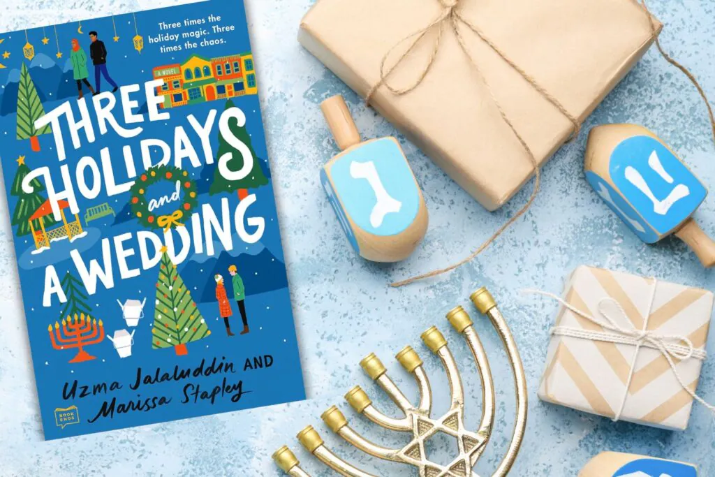 Book cover of Three Holidays and a Wedding on a light blue background surrounded by brown paper wrapped gifts, a menorah, and dreidel