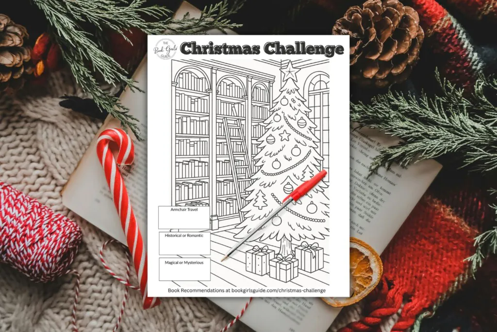 Christmas printable challenge tracker image over open book and christmas decor