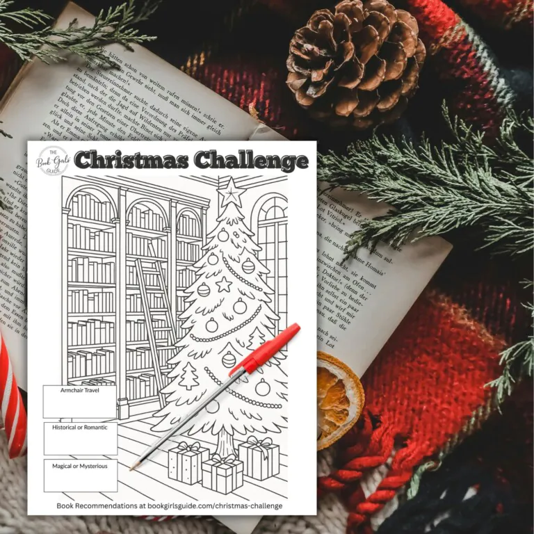 Christmas printable challenge tracker image over open book and christmas decor