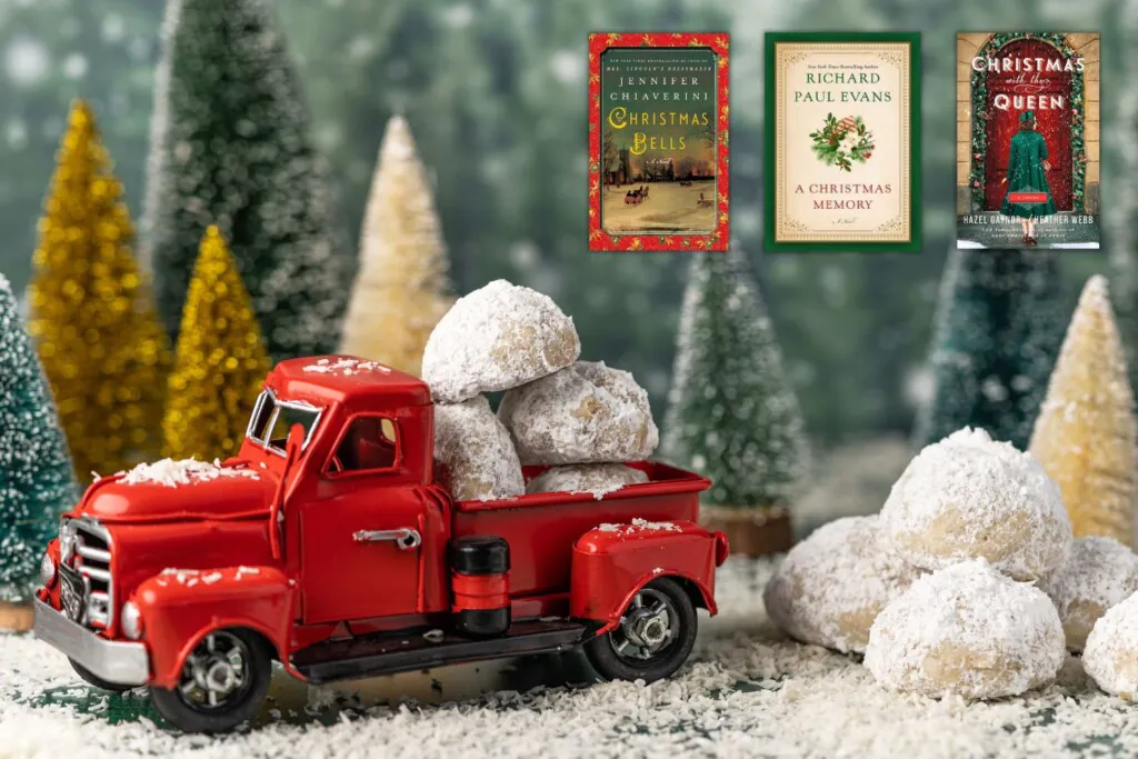 Toy vintage red truck in snowy forest of bottle brush trees