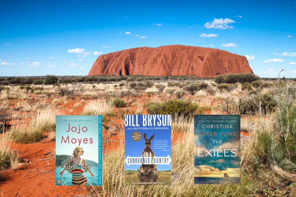 Uluru photo with three book covers on top