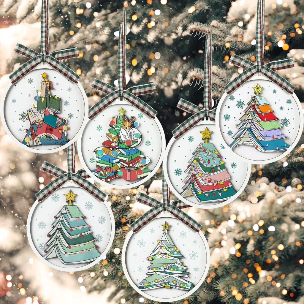 Set of 6 different Christmas ornaments featuring stacked books that look like Christmas trees
