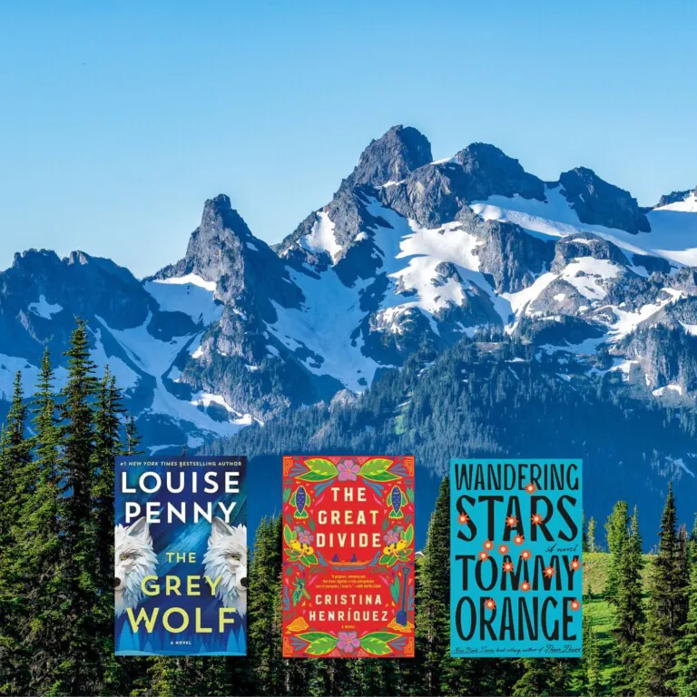 North American mountain range photo with three book covers on top