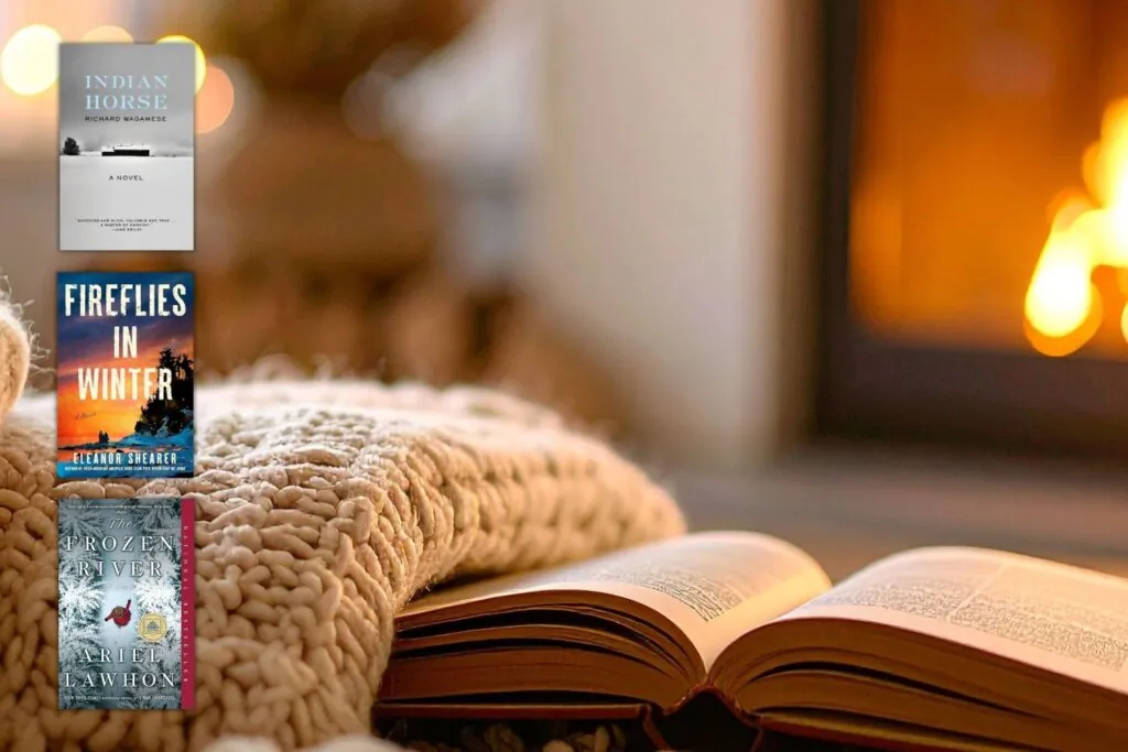 open book in front of fireplace with 3 book covers for winter book club books